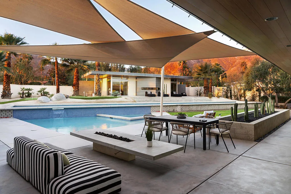 Covered patio with fire pit and pool